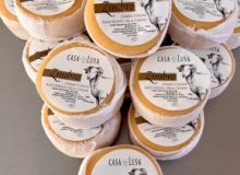 A picture showing 15 Zimbro cheeses. They have been stacked like a 3D image of a pyramid.